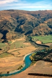 rivers;landscape;agriculture;rural;farming;farms;farm-blocks;block;land;landscape;hill;hilly;hills;range;mountain;mountain-range;cultivated;Clutha;winding;curve;curving;river-course;dry;central-otago;arid;irrigation;field;fields;paddock;paddocks;meadow;meadows