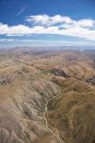 aerial;aerial-photo;aerial-photography;aerial-photos;aerials;agricultural;agriculture;barren;contours;country;countryside;dry;erroded;farm;farming;farmland;farms;High-Country;highland;highlands;Highway-8;hills;hilly;Lindis-Pass;N.Z.;New-Zealand;NZ;Otago;road;rough;rugged;rural;South-Island;State-Highway-8;topography;wild;wilderness