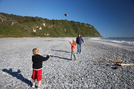 ball;beach;beaches;boy;boys;child;children;families;family;girl;girls;N.Z.;New-Zealand;NZ;Okarito;Okarito-Beach;Piggy-in-the-Middle;play;Playing;playing-ball;S.I.;SI;South-Is.;South-Island;stones;stoney-beach;throw;throwing;West-Coast;Westland