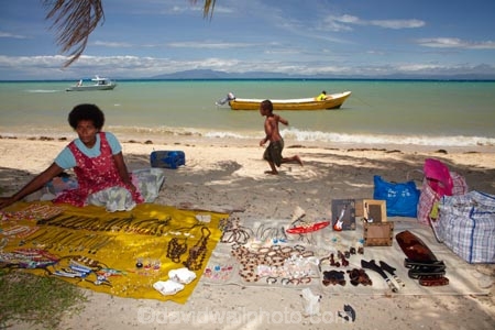 beach;beaches;boat;boats;boy;boys;child;children;coast;coastal;coastline;commerce;commercial;dinghies;dinghy;Fij;Fiji-Islands;Fijian;Fijian-lady;Fijian-village;Fijian-villages;indigenous;island;islands;Malolo-Is;Malolo-Island;Mamanuca-Is;Mamanuca-Islands;Mamanucas;market;market-place;market_place;marketplace;markets;Pacific;people;person;retail;retailer;retailers;runabout;runabouts;sand;sandy;selling;Shell-Village;Shell-Village-trip;shop;shopping;shops;shore;shoreline;Solevu;Solevu-Village;South-Pacific;souvenir;souvenirs;stall;stalls;tourism;village;villages;woman;women