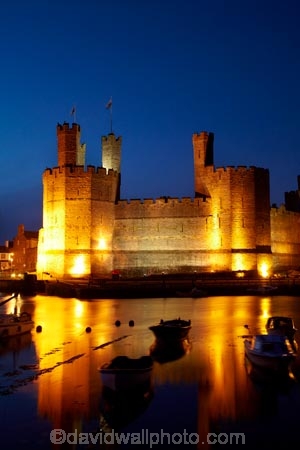Afon-Seiont;battlement;battlements;boat;boats;Britain;British-Isles;building;buildings;Caernarfon;Caernarfon-Castle;calm;Carnarvon;Carnarvon-Castle;Castell-Caernarfon;castellated;castellations;castle;castles;crenellation;crenellations;Cymru;dark;dusk;Dymar-dre;evening;flood-lighting;flood-lights;flood-lit;flood_lighting;flood_lights;flood_lit;floodlighting;floodlights;floodlit;fort;fortification;fortress;fortresses;G.B.;GB;Great-Britain;Gwynedd;heritage;historic;historic-building;historic-buildings;historical;historical-building;historical-buildings;history;light;lights;medieval-castle;medieval-castles;night;night-time;night_time;old;placid;quiet;reflection;reflections;River-Seiont;serene;smooth;still;stone-buidling;stone-building;stone-buildings;tradition;traditional;tranquil;twilight;U.K.;UK;UN-world-heritage-site;UNESCO-World-Heritage-Site;United-Kingdom;united-nations-world-heritage-site;Wales;water;Welsh-Castle;Welsh-Castles;Welsh-Flag;Welsh-flags;world-heritage;World-Heritage-Park;World-Heritage-site;World-Heritage-Sites