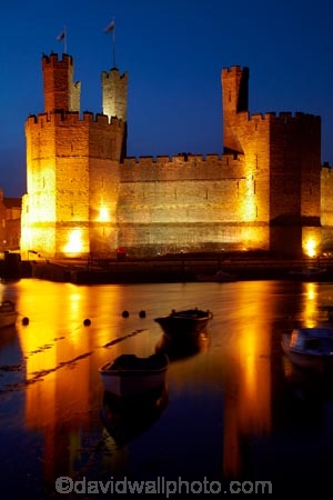 Afon-Seiont;battlement;battlements;boat;boats;Britain;British-Isles;building;buildings;Caernarfon;Caernarfon-Castle;calm;Carnarvon;Carnarvon-Castle;Castell-Caernarfon;castellated;castellations;castle;castles;crenellation;crenellations;Cymru;dark;dusk;Dymar-dre;evening;flood-lighting;flood-lights;flood-lit;flood_lighting;flood_lights;flood_lit;floodlighting;floodlights;floodlit;fort;fortification;fortress;fortresses;G.B.;GB;Great-Britain;Gwynedd;heritage;historic;historic-building;historic-buildings;historical;historical-building;historical-buildings;history;light;lights;medieval-castle;medieval-castles;night;night-time;night_time;old;placid;quiet;reflection;reflections;River-Seiont;serene;smooth;still;stone-buidling;stone-building;stone-buildings;tradition;traditional;tranquil;twilight;U.K.;UK;UN-world-heritage-site;UNESCO-World-Heritage-Site;United-Kingdom;united-nations-world-heritage-site;Wales;water;Welsh-Castle;Welsh-Castles;Welsh-Flag;Welsh-flags;world-heritage;World-Heritage-Park;World-Heritage-site;World-Heritage-Sites