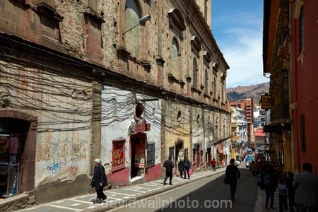 alley;alleys;alleyway;alleyways;Bolivia;Bolivian;building;buildings;capital;Capital-of-Bolivia;Cathedral-Basilica-of-Our-Lady-of-Peace;Chuqi-Yapu;cities;city;heritage;historic;historic-building;historic-buildings;historical;historical-building;historical-buildings;history;Hostel-Torino;Hotel-Torino;La-Paz;La-Paz-Basilica;La-Paz-Cathedral;Latin-America;Narrow-street;narrow-streets;Nuestra-Señora-de-La-Paz;old;people;person;power-lines;power-wires;Socabaya;South-America;steep-street;steep-streets;Sth-America;street;streets;The-Americas;tradition;traditional;wired;wires