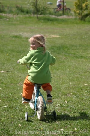 girl;girls;little;child;children;play;playing;playground;play_ground;play-ground;playgrounds;play_grounds;play-grounds;grass;green;grassy;outdoor;outdoors;outside;playtime;fun;moving;movement;childhood;happiness;happy;joy;kid;kids;bike;bikes;cycle;cycles;bicycle;bicycles;two_wheeler;two-wheeler;two_wheelers;two-wheelers;training-wheels;training_wheels;learn;learns;learning;learner;first-ride;ride;rider;riding;riders;training;daughter